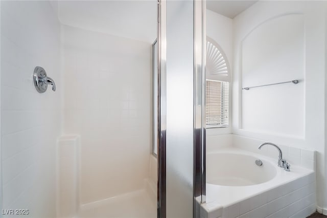 full bath with a shower stall and a garden tub