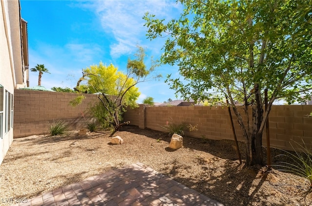 fenced backyard featuring a patio area