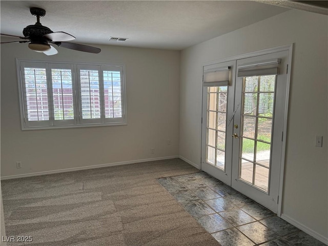 311 Glenoaks St, Pahrump, NV 89048 - empty room featuring a ceiling fan, french doors, and baseboards