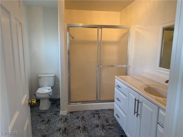 311 Glenoaks St, Pahrump, NV 89048 - full bath featuring toilet, a shower stall, vanity, and baseboards