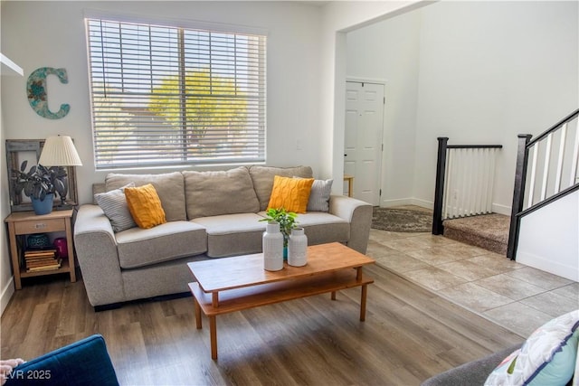 5733 Coral Sun St, North Las Vegas, NV 89031 - living area with baseboards, light wood-style floors, and stairs