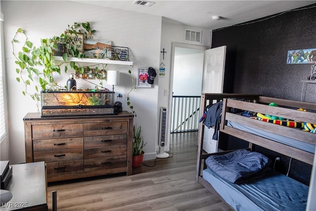 5733 Coral Sun St, North Las Vegas, NV 89031 - bedroom with wood finished floors