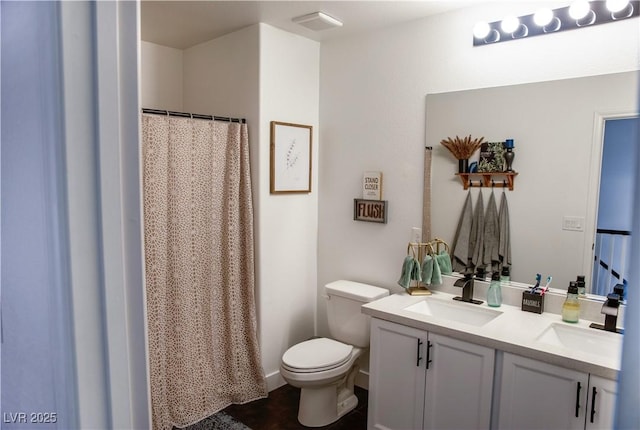 5733 Coral Sun St, North Las Vegas, NV 89031 - full bathroom featuring toilet, double vanity, and a shower with shower curtain