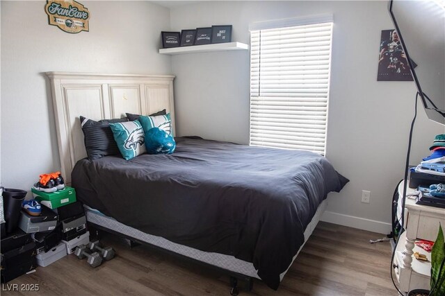 5733 Coral Sun St, North Las Vegas, NV 89031 - bedroom with wood finished floors and baseboards