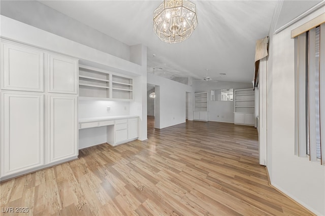 9917 Arbuckle Dr, Las Vegas, NV 89134 - unfurnished living room with ceiling fan, light wood finished floors, a chandelier, and vaulted ceiling