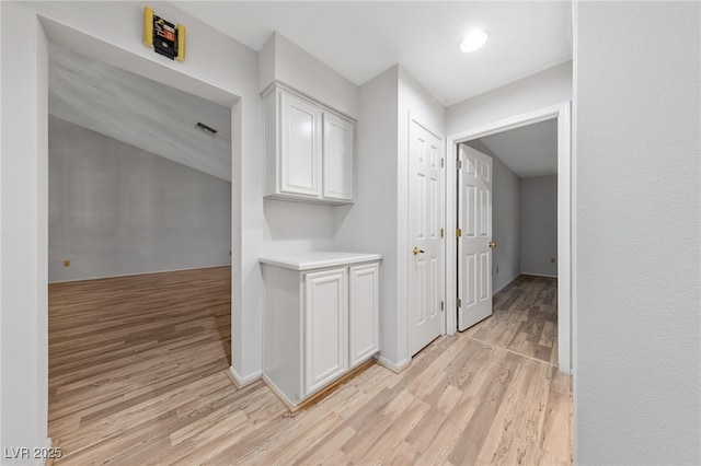 9917 Arbuckle Dr, Las Vegas, NV 89134 - hallway with light wood-style floors and baseboards