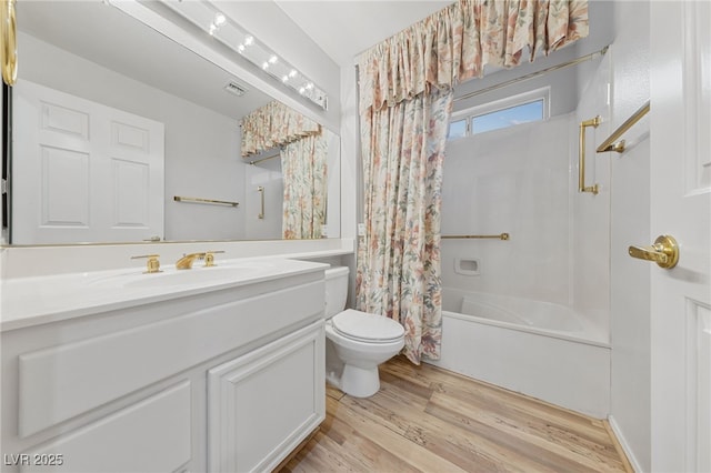 9917 Arbuckle Dr, Las Vegas, NV 89134 - full bath featuring toilet, wood finished floors, vanity, and shower / bath combo