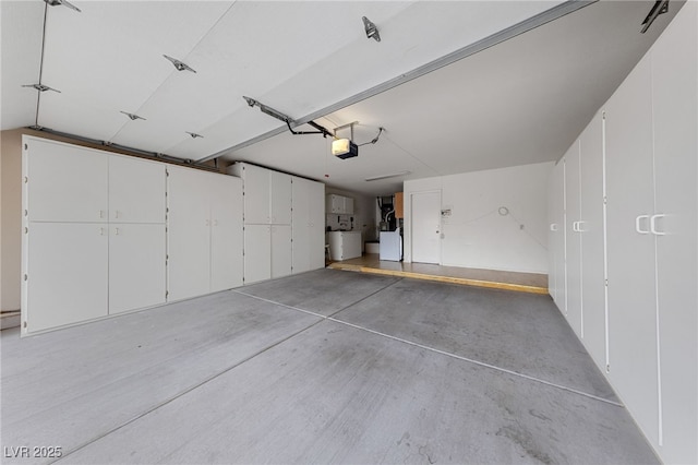 9917 Arbuckle Dr, Las Vegas, NV 89134 - garage featuring a garage door opener and washer / dryer