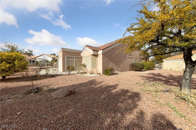 9917 Arbuckle Dr, Las Vegas, NV 89134 - back of property with stucco siding and a tile roof
