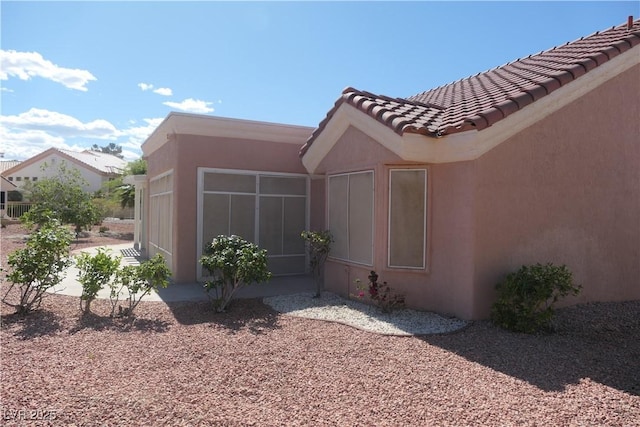 9917 Arbuckle Dr, Las Vegas, NV 89134 - view of home's exterior featuring a tile roof and stucco siding