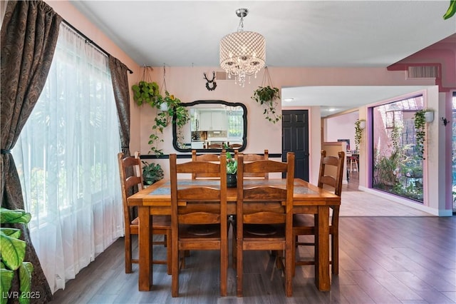 2479 Domingo St, Las Vegas, NV 89121 - dining area featuring wood finished floors and a chandelier