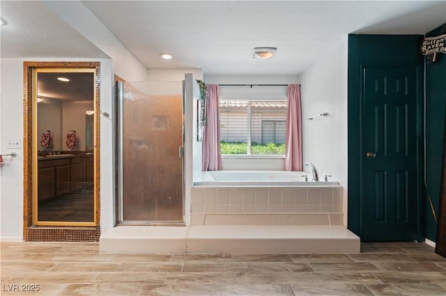 2479 Domingo St, Las Vegas, NV 89121 - full bathroom featuring a bath, a stall shower, vanity, a closet, and recessed lighting