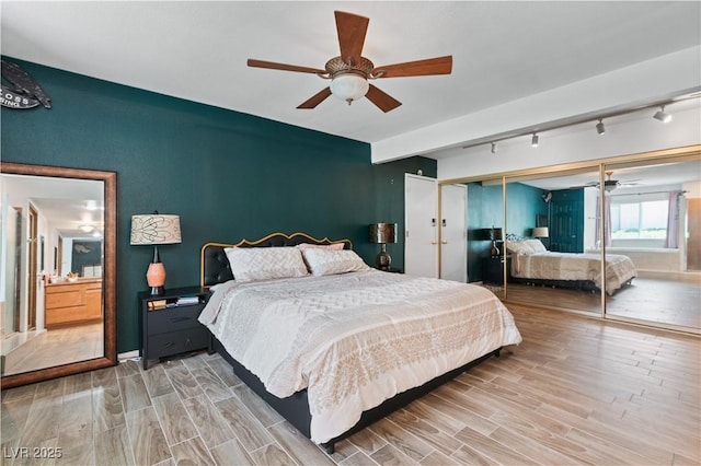 2479 Domingo St, Las Vegas, NV 89121 - bedroom with wood finished floors, a closet, ceiling fan, and track lighting