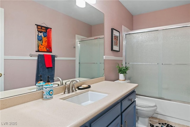 2479 Domingo St, Las Vegas, NV 89121 - bathroom featuring vanity, toilet, enclosed tub / shower combo, and tile patterned floors