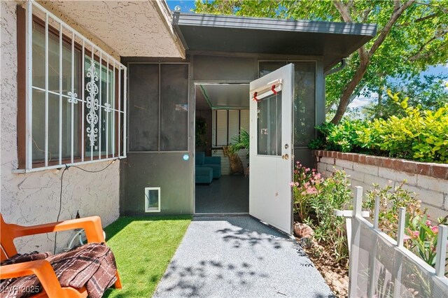 2479 Domingo St, Las Vegas, NV 89121 - view of exterior entry featuring stucco siding