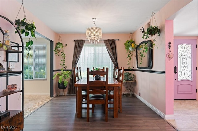 2479 Domingo St, Las Vegas, NV 89121 - dining area with a chandelier, healthy amount of natural light, wood finished floors, and baseboards