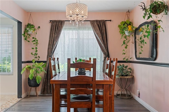 2479 Domingo St, Las Vegas, NV 89121 - dining area with a chandelier, wood finished floors, and baseboards