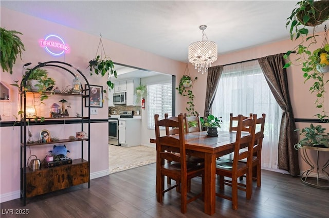 2479 Domingo St, Las Vegas, NV 89121 - dining area featuring a chandelier and dark wood finished floors