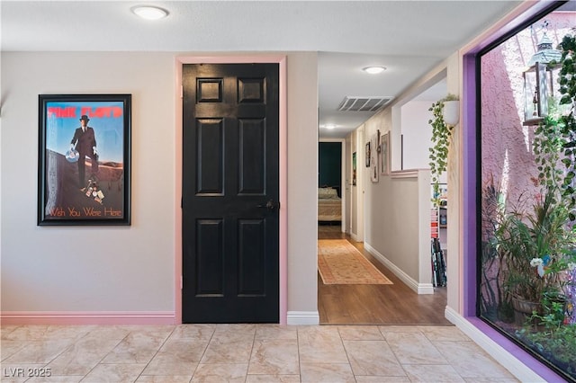 2479 Domingo St, Las Vegas, NV 89121 - corridor featuring baseboards and light marble finish floors