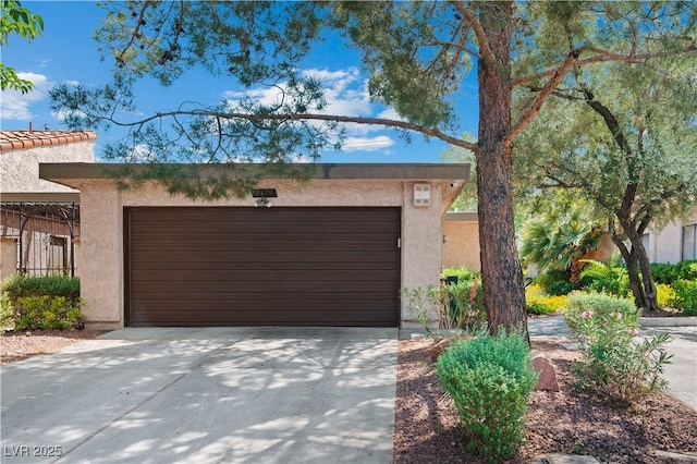 2479 Domingo St, Las Vegas, NV 89121 - view of front of home featuring stucco siding, an attached garage, and concrete driveway