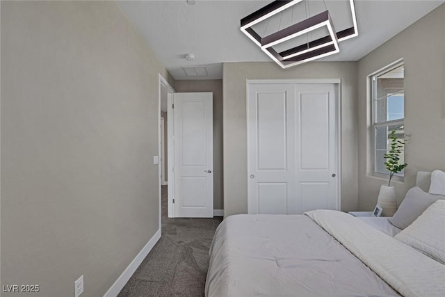 2246 Bird Of Prey St, Las Vegas, NV 89138 - bedroom featuring baseboards, dark colored carpet, and a closet
