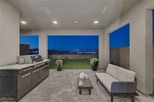 2246 Bird Of Prey St, Las Vegas, NV 89138 - fenced backyard with an outdoor kitchen, a patio area, and outdoor lounge area