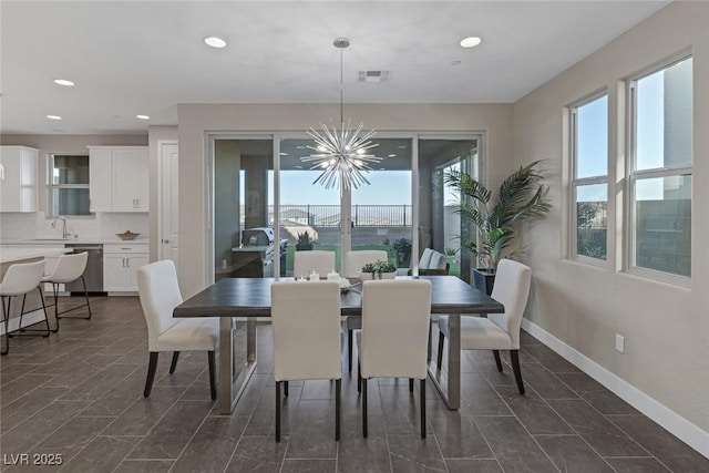 2246 Bird Of Prey St, Las Vegas, NV 89138 - dining space featuring a chandelier, recessed lighting, and baseboards