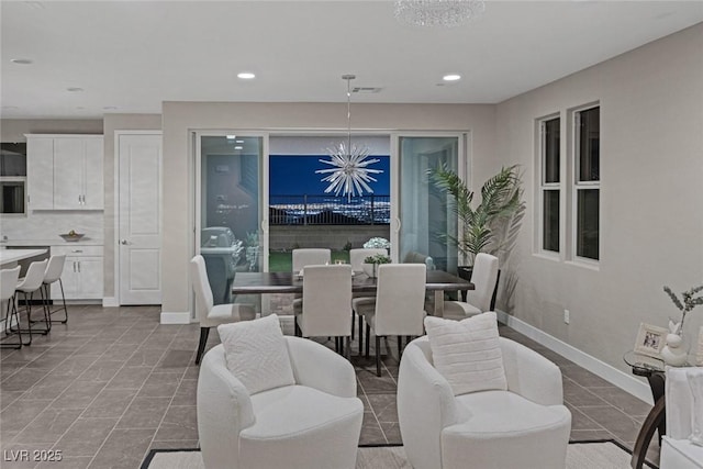 2246 Bird Of Prey St, Las Vegas, NV 89138 - dining area with a chandelier, recessed lighting, and baseboards