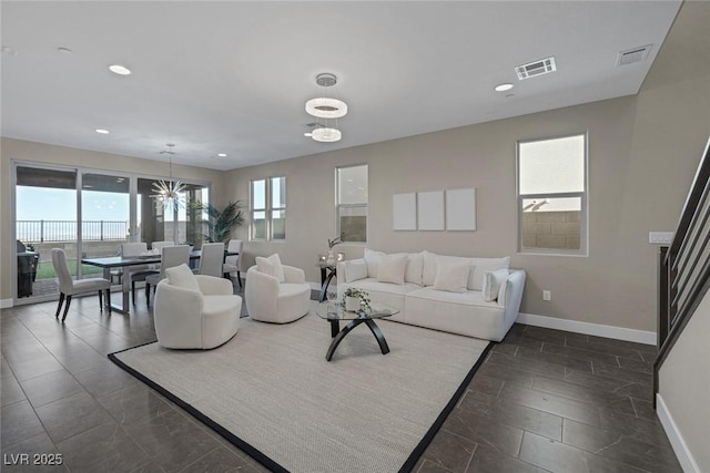 2246 Bird Of Prey St, Las Vegas, NV 89138 - living area with baseboards, recessed lighting, and a chandelier