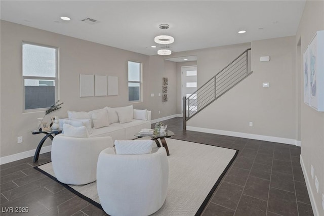 2246 Bird Of Prey St, Las Vegas, NV 89138 - living room featuring plenty of natural light, stairs, baseboards, recessed lighting, and dark tile patterned floors