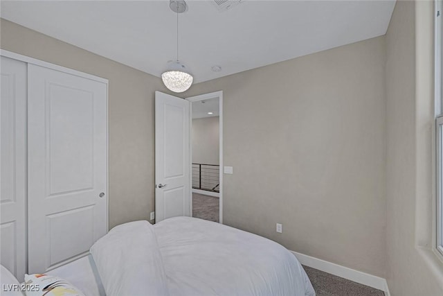 2246 Bird Of Prey St, Las Vegas, NV 89138 - carpeted bedroom with baseboards and a closet