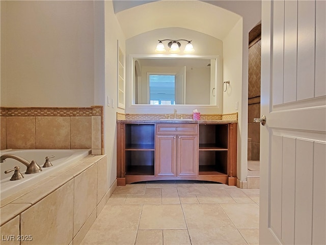 bathroom with vanity, a bath, and tile patterned flooring
