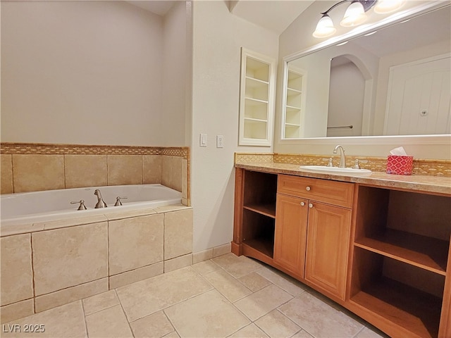 bathroom with a bath, vanity, and tile patterned flooring