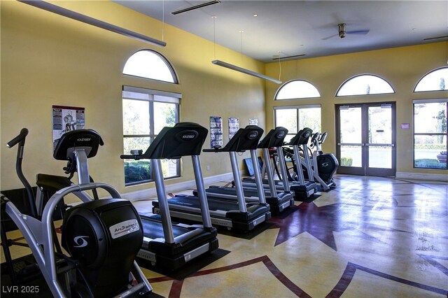 workout area with healthy amount of natural light, french doors, and ceiling fan