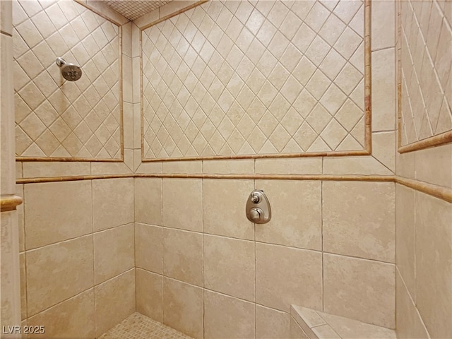 full bath with tiled shower