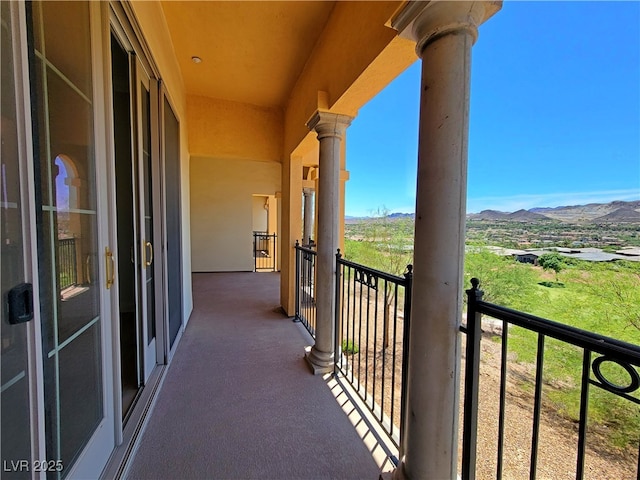 balcony featuring a mountain view