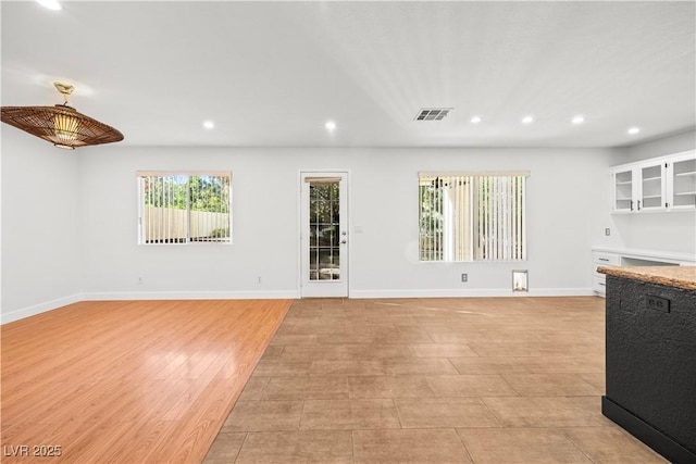 9520 Rancho Palmas Dr, Las Vegas, NV 89117 - unfurnished living room with recessed lighting and baseboards