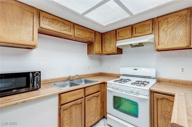 875 Rhinegold Way, Las Vegas, NV 89110 - kitchen featuring white gas range oven, under cabinet range hood, black microwave, a sink, and light countertops