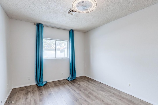 875 Rhinegold Way, Las Vegas, NV 89110 - unfurnished room with wood finished floors, a textured ceiling, and baseboards