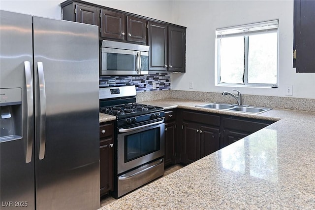 5650 E Sahara Ave Unit 2062, Las Vegas, NV 89142 - kitchen featuring appliances with stainless steel finishes, a sink, and backsplash