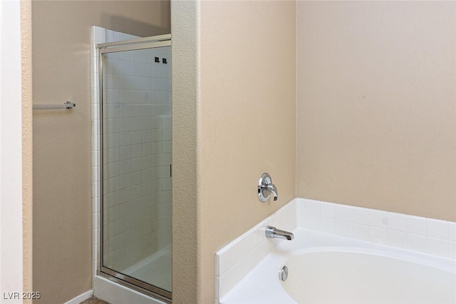 5650 E Sahara Ave Unit 2062, Las Vegas, NV 89142 - full bath featuring a stall shower and a garden tub
