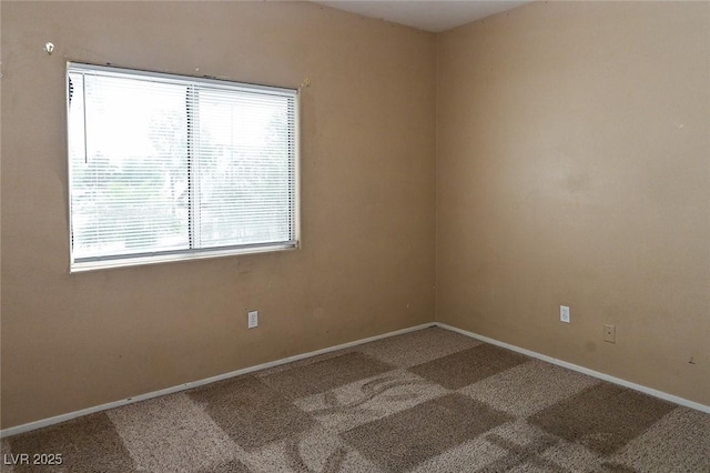 5650 E Sahara Ave Unit 2062, Las Vegas, NV 89142 - unfurnished room with healthy amount of natural light, carpet, and baseboards