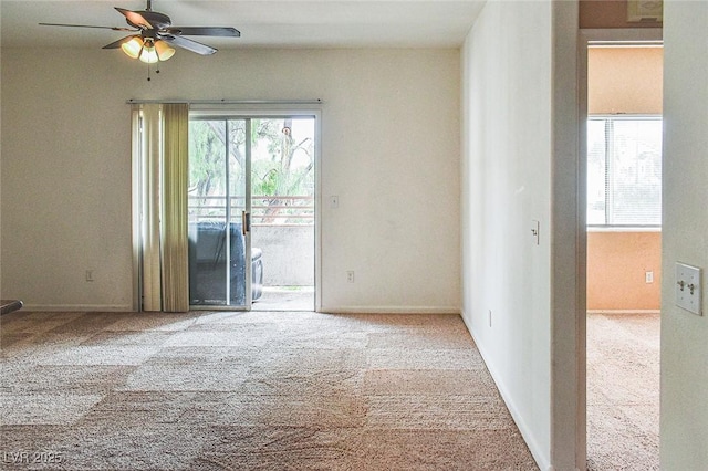 5650 E Sahara Ave Unit 2062, Las Vegas, NV 89142 - carpeted empty room featuring plenty of natural light, a ceiling fan, and baseboards