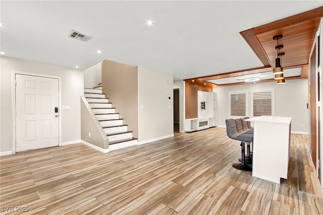 dining space with baseboards, light wood-style floors, stairway, and recessed lighting