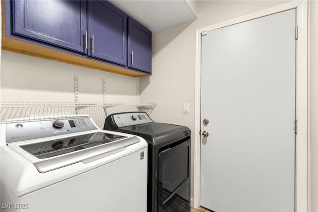 laundry area with cabinet space and washing machine and clothes dryer