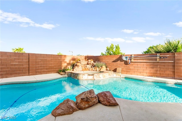 view of swimming pool featuring a fenced backyard and a pool with connected hot tub