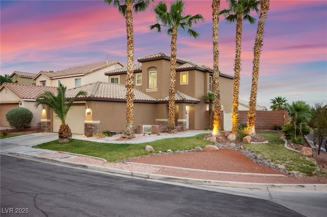 1200 Dream Bridge Dr, Las Vegas, NV 89144 - mediterranean / spanish house featuring stucco siding, concrete driveway, an attached garage, and a tile roof