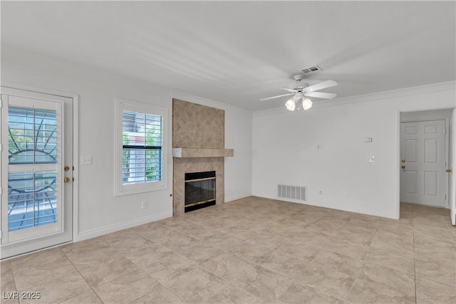 8437 Apple Hill Ct, Las Vegas, NV 89128 - unfurnished living room with plenty of natural light, ceiling fan, a tile fireplace, and ornamental molding