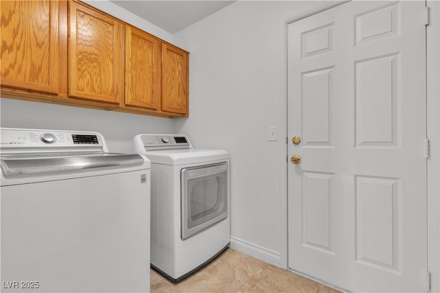 8437 Apple Hill Ct, Las Vegas, NV 89128 - washroom with separate washer and dryer, cabinet space, and baseboards