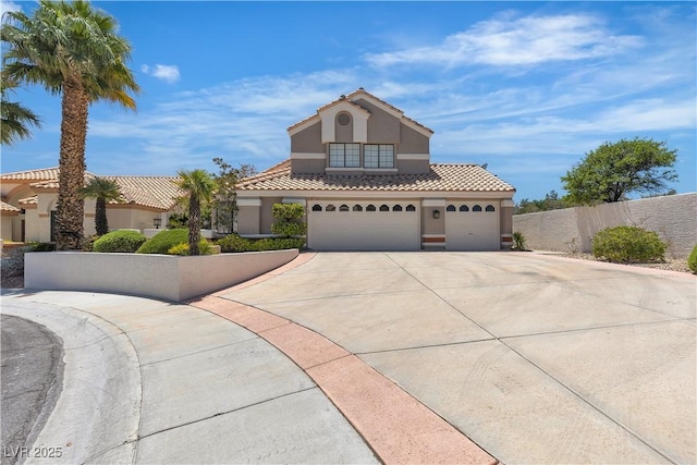 8437 Apple Hill Ct, Las Vegas, NV 89128 - mediterranean / spanish-style home featuring driveway, stucco siding, fence, a tiled roof, and a garage